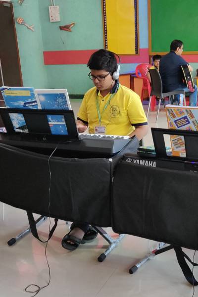 Young students learning music at AMA academy